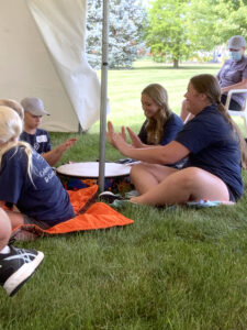 Campers participating in a music activity